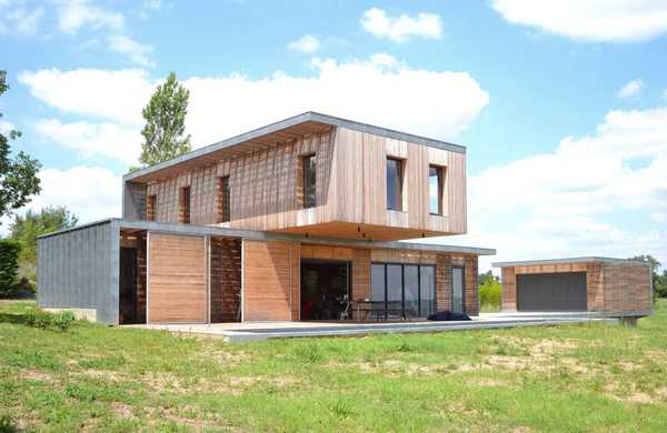 Réalisation d'une maison individuelle contemporaine avec bois et béton dans un esprit Loft par un architecte à Tours.